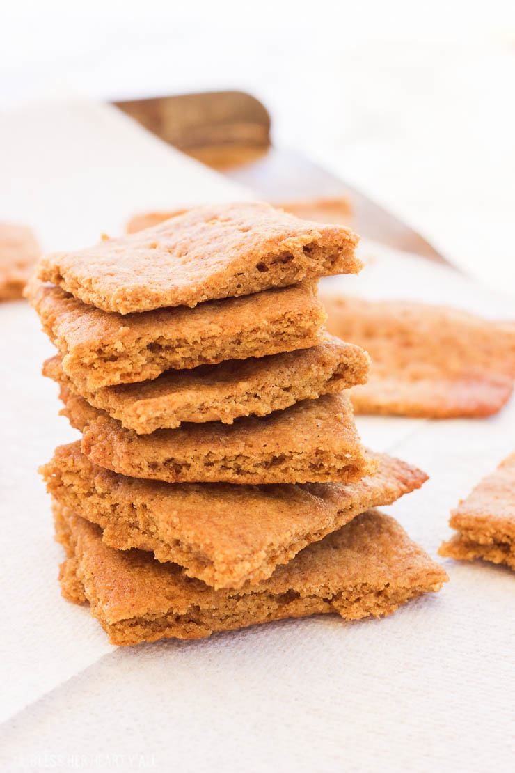 Paleo Gluten-Free Graham Crackers || These paleo gluten-free graham crackers are an easy 15 minute recipe that uses simple ingredients to make moist on the inside and toasted on the outside squares just in time for s'more season! www.BlessHerHeartYall.com