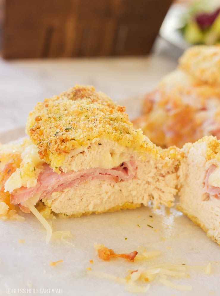 This gluten free chicken cordon bleu recipe is both quick and easy. Crunchy outer coating and juicy chicken in the middle, all topped with warm ham and ooey gooey melted swiss cheese! www.blessherheartyall.com