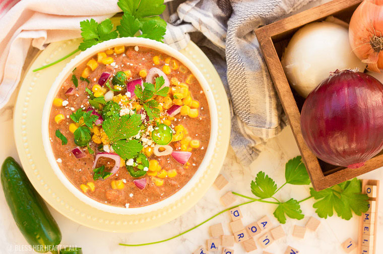 This slow cooker white turkey chili combines juicy leftover roasted turkey, chunky vegetables, and garlic, oregano, paprika, and spice to make a delicious stick-to-your-ribs meal that's so simple to make and so comforting to eat! It's also gluten free, dairy free and low carb! www.blessherheartyall.com