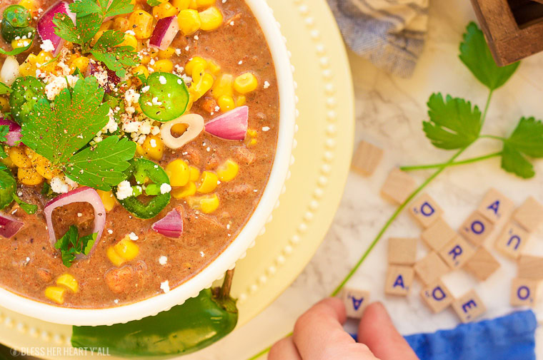 This slow cooker white turkey chili combines juicy leftover roasted turkey, chunky vegetables, and garlic, oregano, paprika, and spice to make a delicious stick-to-your-ribs meal that's so simple to make and so comforting to eat! It's also gluten free, dairy free and low carb! www.blessherheartyall.com