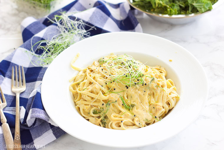 This vegan butternut squash pasta with kale and onion sprouts recipe is not only a showstopper, but it's packed full of nutrients and is also gluten-free, grain free, dairy free, and paleo friendly. Dive into this creamy savory dish in under 15 minutes! www.BlessHerHeartYall.com