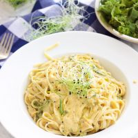 This vegan butternut squash pasta with kale and onion sprouts recipe is not only a showstopper, but it's packed full of nutrients and is also gluten-free, grain free, dairy free, and paleo friendly. Dive into this creamy savory dish in under 15 minutes! www.BlessHerHeartYall.com