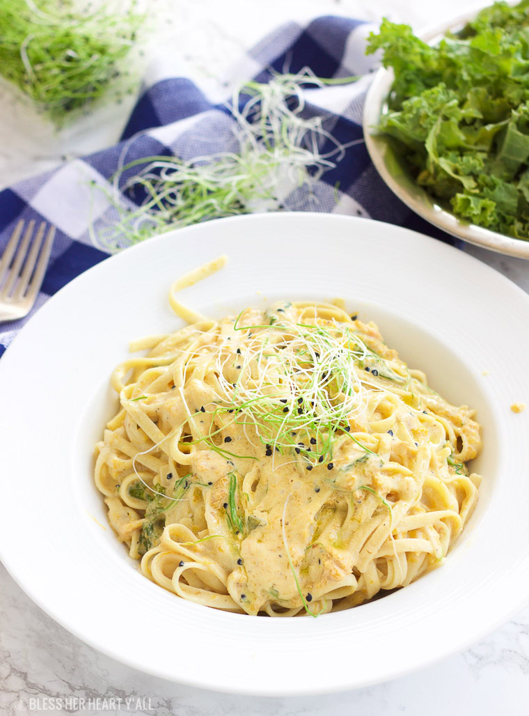 This vegan butternut squash pasta with kale and onion sprouts recipe is not only a showstopper, but it's packed full of nutrients and is also gluten-free, grain free, dairy free, and paleo friendly. Dive into this creamy savory dish in under 15 minutes! www.BlessHerHeartYall.com