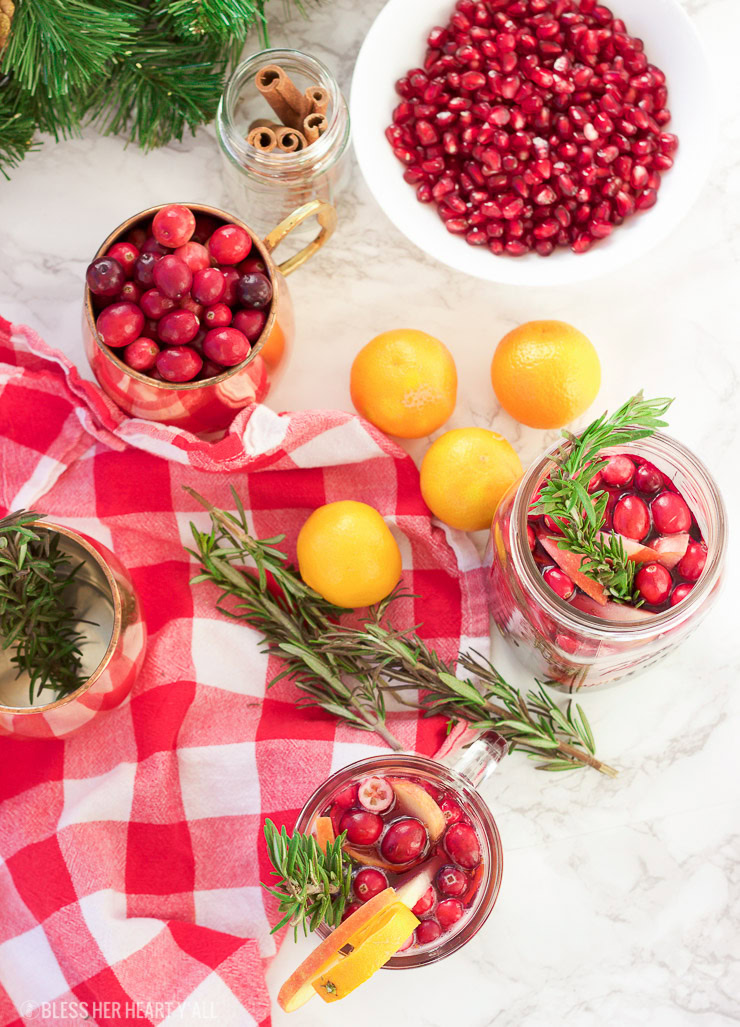 This winter pomegranate cranberry sangria recipe is a quick and easy twist on the popular sangria drink. Impress everyone at your next holiday or Christmas party with this sparkling red wine cocktail with apples, oranges, pomegranate, cranberry, rosemary, and cinnamon sticks! Get your drink on fancy pants!