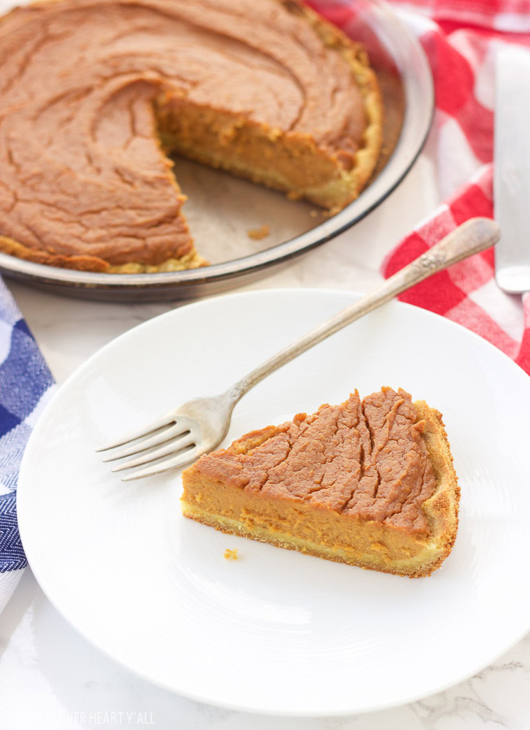 This paleo sweet potato pie is made with simple healthy ingredients and is both decadent and smooth. This southern treat is also gluten free, grain free, and dairy free! Bring on the holidays with this easy recipe y'all! www.blessherheartyall.com