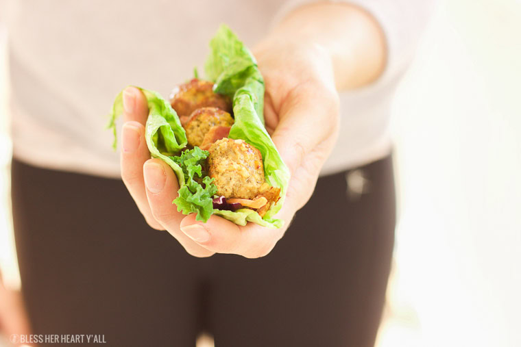 This pumpkin sage meatball lettuce wrap + hot bacon vinaigrette recipe is juicy and savory, with fresh crisp vegetables and moist round meatballs drizzled in a warm bacon dressing with a touch of heat!