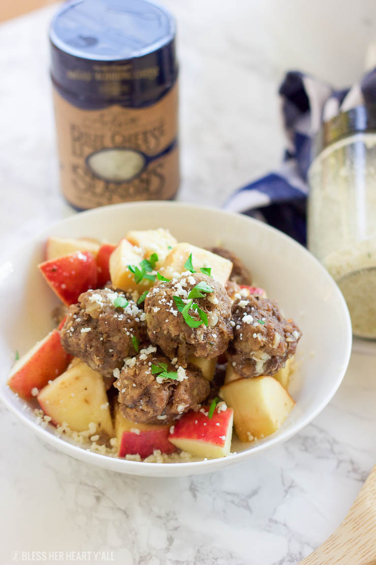 This easy slow cooker apple cider meatball recipe dunks fresh meatballs and juicy apple slices in apple cider, garlic, and blue cheese crumbles for a delicious fall spin. Bring them to a fall party and they will be gone in seconds! www.BlessHerHeartYall.com