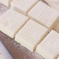 These gluten-free vanilla marshmallows are easy and simple to make and are sweet and fluffy. This classic homemade treat is great inside of a s'more or fantastic all on it's own!