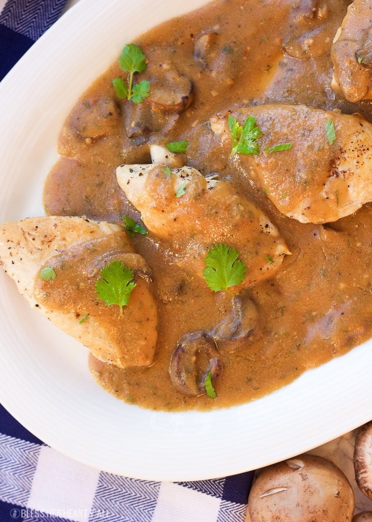 This one-pot garlic mushroom chicken skillet cooks juicy chicken breasts and uses the drippings to make a quick creamy garlic mushroom gravy. The thick savory sauce brings out a cozy warm flavor to this comfort food, perfect for when you only have 20 minutes to spare!