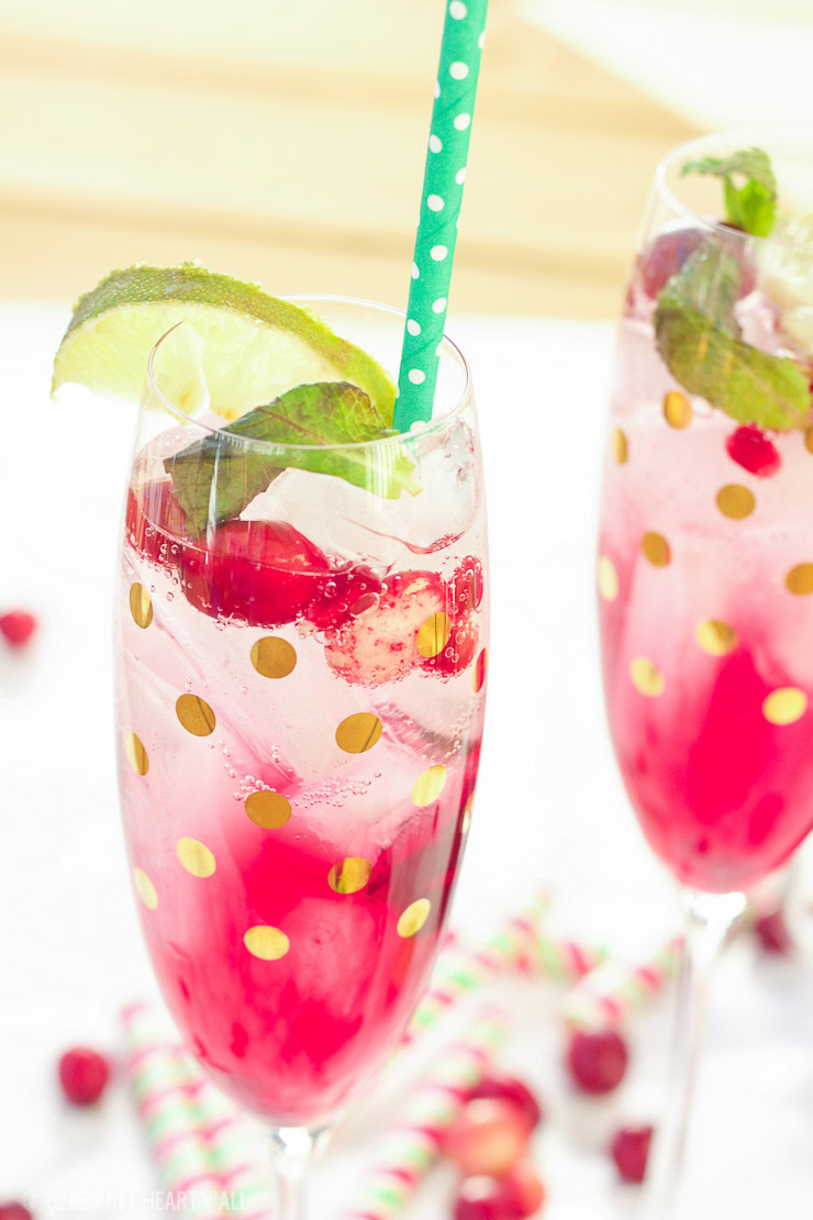 This pomegranate cranberry mojito recipe tastes just as it looks - juicy, sweet, refreshing, and light! With only a few simple ingredients, these cocktails are perfect for your winter holiday parties and for ringing in the new year!