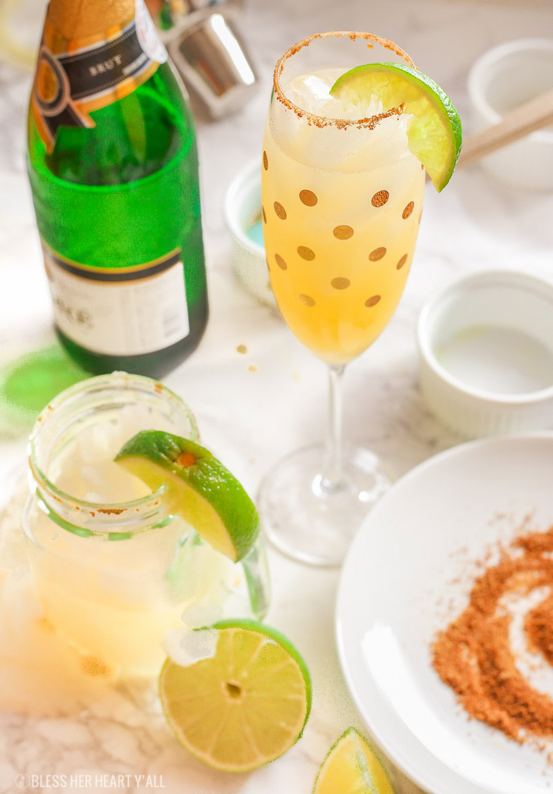 These skinny champagne margaritas are epicly delicious and prepared two different ways. There is no need for sugar or simple syrup for this recipe that uses a combination of fresh lime and orange juices as well as honey to sweeten and packs a punch with it's tequila and champagne, perfect for any New Year's Eve fiesta!