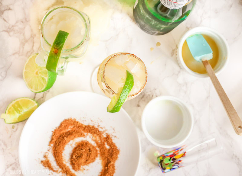 These skinny champagne margaritas are epicly delicious and prepared two different ways. There is no need for sugar or simple syrup for this recipe that uses a combination of fresh lime and orange juices as well as honey to sweeten and packs a punch with it's tequila and champagne, perfect for any New Year's Eve fiesta!