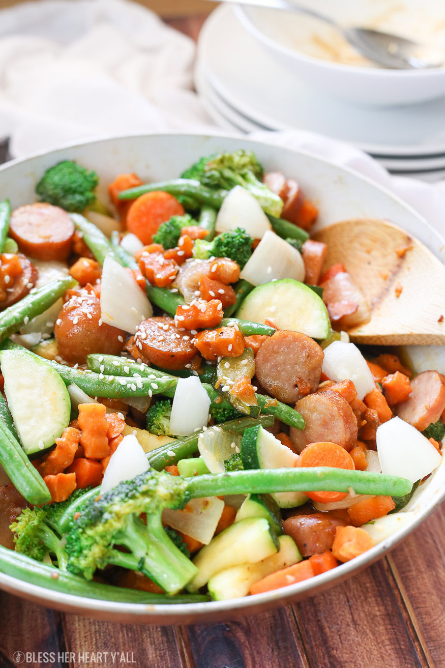 Sweet potato stir fry with chicken sausage slices are combined with fresh vegetables and a simple sweet and savory paleo stir fry sauce for one epically healthy meal your family will ask for time and time again.