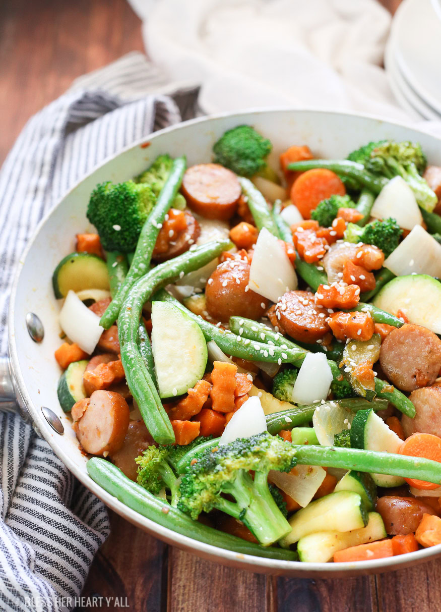 Sweet potato stir fry with chicken sausage slices are combined with fresh vegetables and a simple sweet and savory paleo stir fry sauce for one epically healthy meal your family will ask for time and time again.