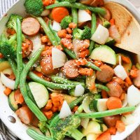 Sweet potato stir fry with chicken sausage slices are combined with fresh vegetables and a simple sweet and savory paleo stir fry sauce for one epically healthy meal your family will ask for time and time again.