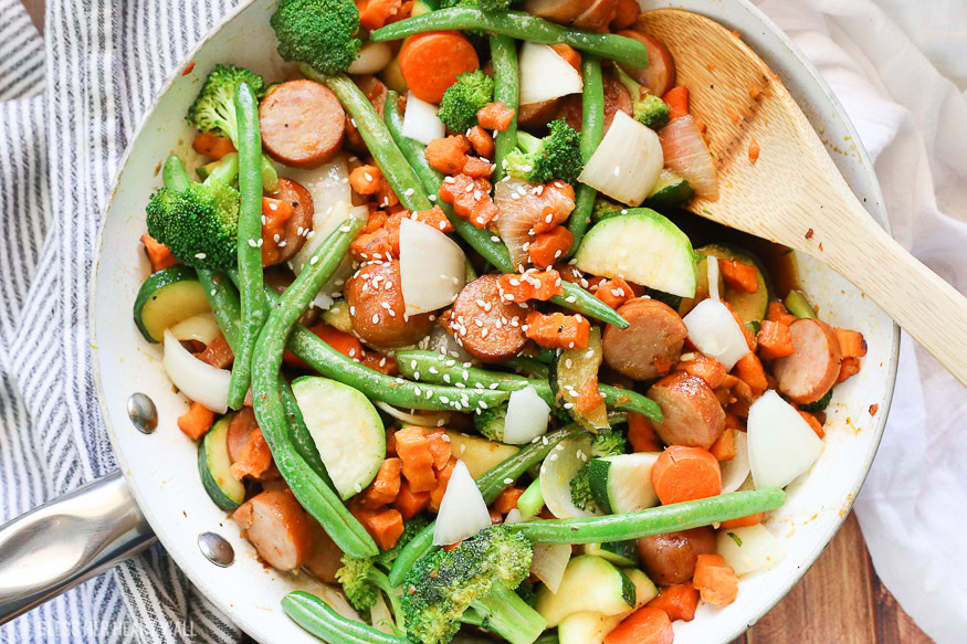 Sweet potato stir fry with chicken sausage slices are combined with fresh vegetables and a simple sweet and savory paleo stir fry sauce for one epically healthy meal your family will ask for time and time again.