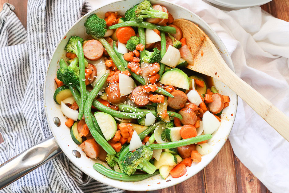 Sweet potato stir fry with chicken sausage slices are combined with fresh vegetables and a simple sweet and savory paleo stir fry sauce for one epically healthy meal your family will ask for time and time again.