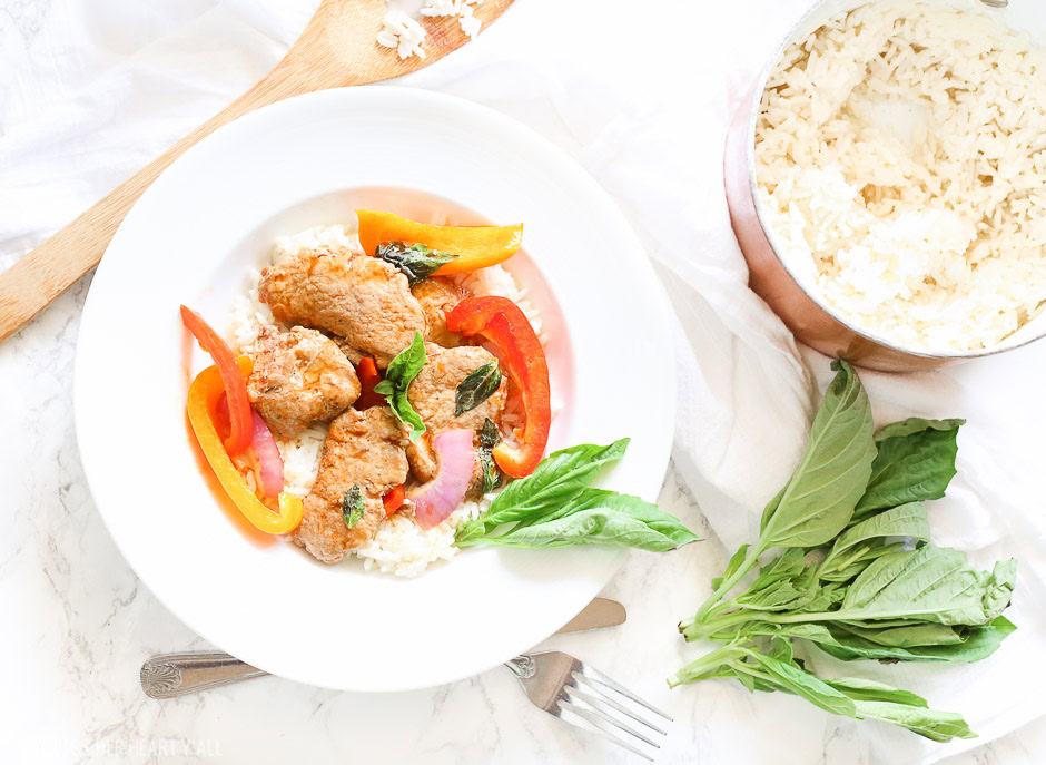 Tender juicy pork loin is cooked in a skillet with fresh vegetables and finished in an easy thai basil sauce all in under 30 minutes! This thai basil pork skillet is the perfect quick and easy weeknight meal that the whole family will love!