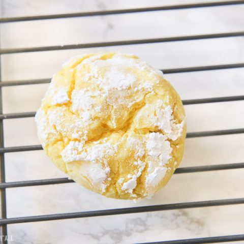 Gluten free lemon crinkle cookies combine light fresh lemon flavors into soft and doughy cookies that are sprinkled in delicious powdered sugar before being baked for a quick 10 minutes!