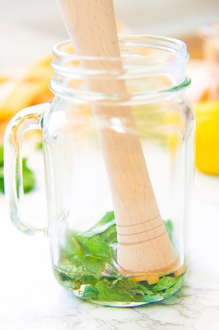 This lemonade mint julep recipe blends summer's most refreshing fresh squeezed lemonade and stirs it up into spring's hottest mint julep cocktail! Lemon, bourbon, mint, and sweet that's perfect for an outdoor party, watching the Kentucky Derby, or just a relaxing time outside on your back porch!