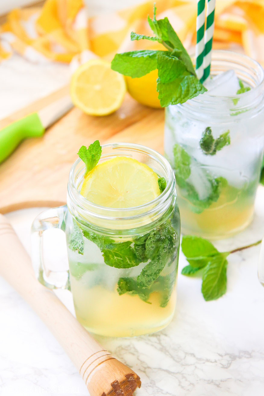 This lemonade mint julep recipe blends summer's most refreshing fresh squeezed lemonade and stirs it up into spring's hottest mint julep cocktail! Lemon, bourbon, mint, and sweet that's perfect for an outdoor party, watching the Kentucky Derby, or just a relaxing time outside on your back porch!