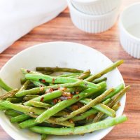 This easy 10-minute teriyaki green beans recipe sautées fresh or frozen green beans with chopped onion and garlic in a quick homemade teriyaki sauce that will leave you licking your plate clean!