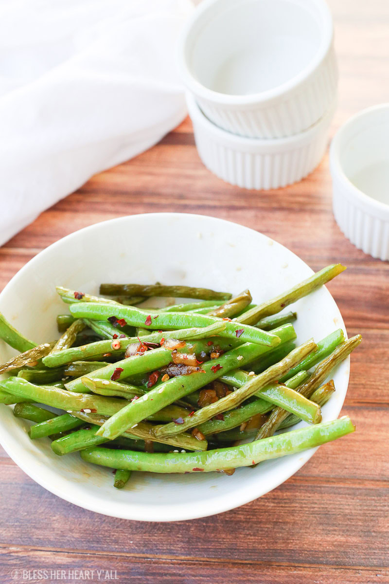 This easy 10-minute teriyaki green beans recipe sautées fresh or frozen green beans with chopped onion and garlic in a quick homemade teriyaki sauce that will leave you licking your plate clean!