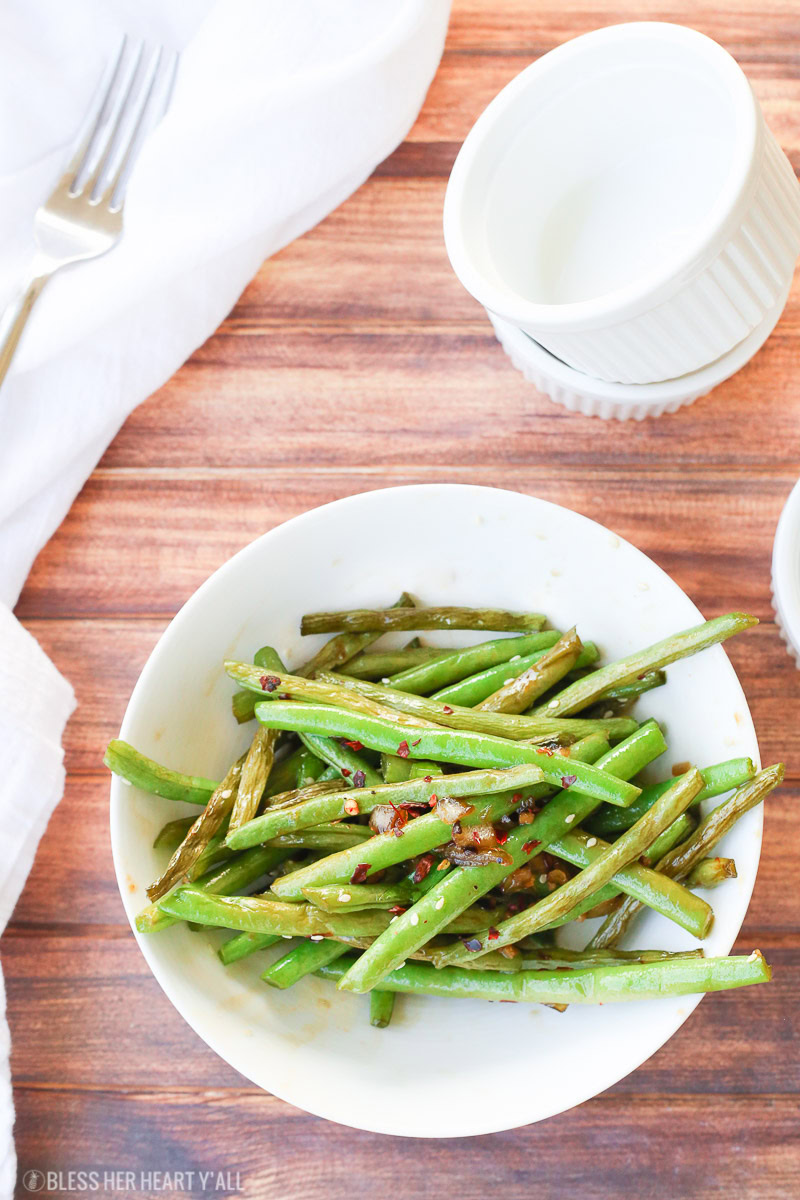 This easy 10-minute teriyaki green beans recipe sautées fresh or frozen green beans with chopped onion and garlic in a quick homemade teriyaki sauce that will leave you licking your plate clean!