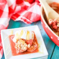 This gluten-free strawberry crumble warms sweet juicy strawberry pieces with a soft and sweet crisp topping. Perfect with vanilla bean ice cream and a drizzle of fresh honey!