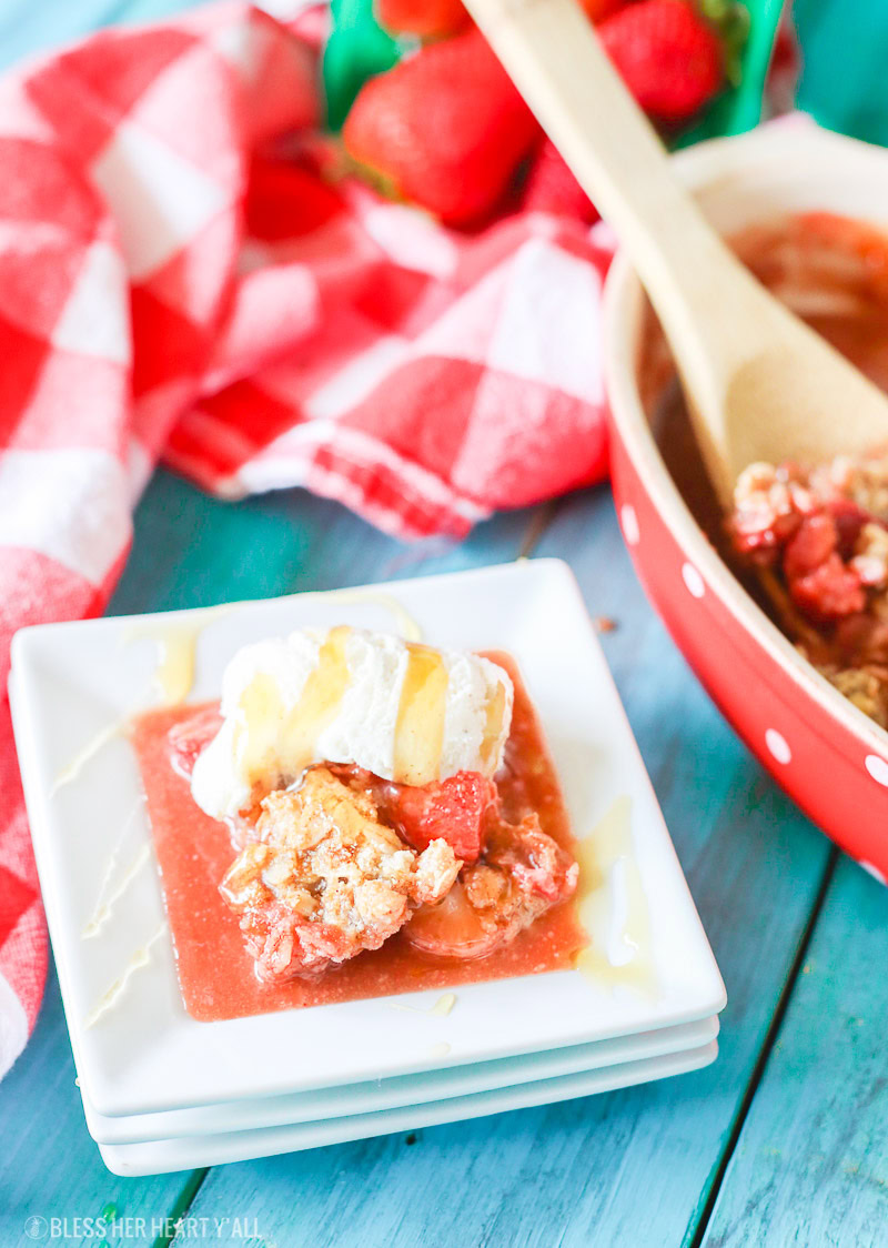 This gluten-free strawberry crumble warms sweet juicy strawberry pieces with a soft and sweet crisp topping. Perfect with vanilla bean ice cream and a drizzle of fresh honey!