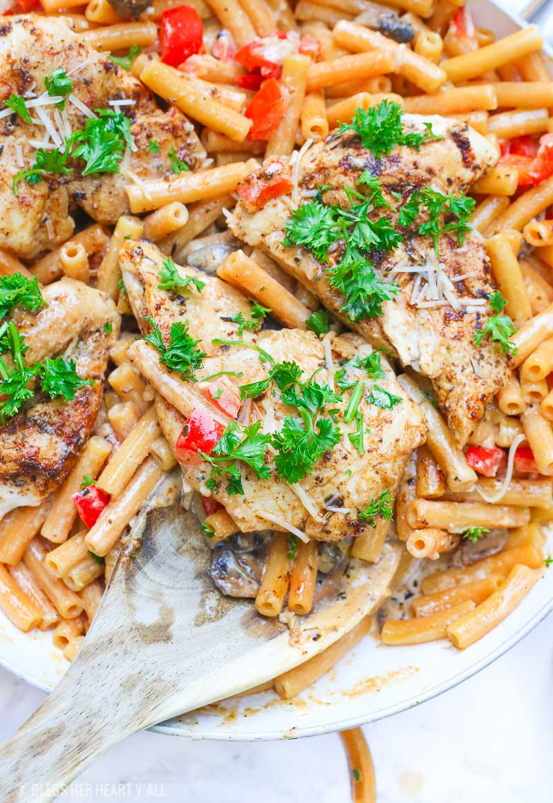 Cajun chicken pasta melts juicy cajun-seasoned chicken breasts with al dente gluten-free noodles in an easy creamy pasta sauce and sprinkled with extra gooey cheeses and herbs all in under 30 minutes! image 7