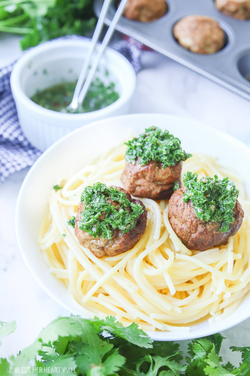 Chimichurri meatballs bake juicy bites of fresh beef and cilantro and then drizzle them with an easy homemade chimichurri sauce! This quick appetizer recipe is low carb, paleo, gluten free!