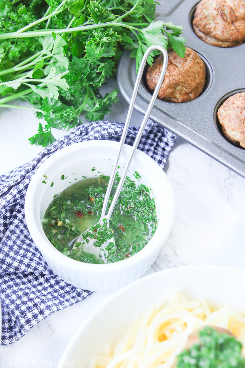 Chimichurri meatballs bake juicy bites of fresh beef and cilantro and then drizzle them with an easy homemade chimichurri sauce! This quick appetizer recipe is low carb, paleo, gluten free!