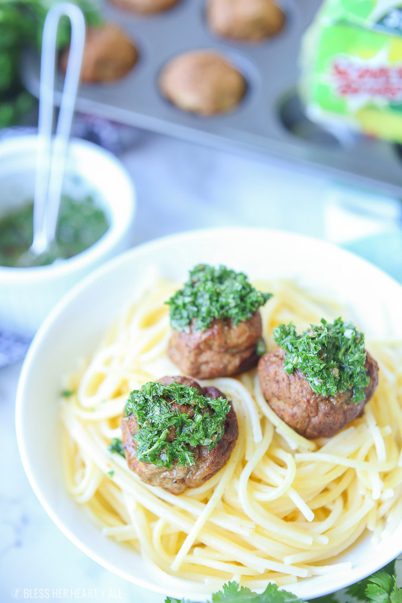 Chimichurri meatballs bake juicy bites of fresh beef and cilantro and then drizzle them with an easy homemade chimichurri sauce! This quick appetizer recipe is low carb, paleo, gluten free!