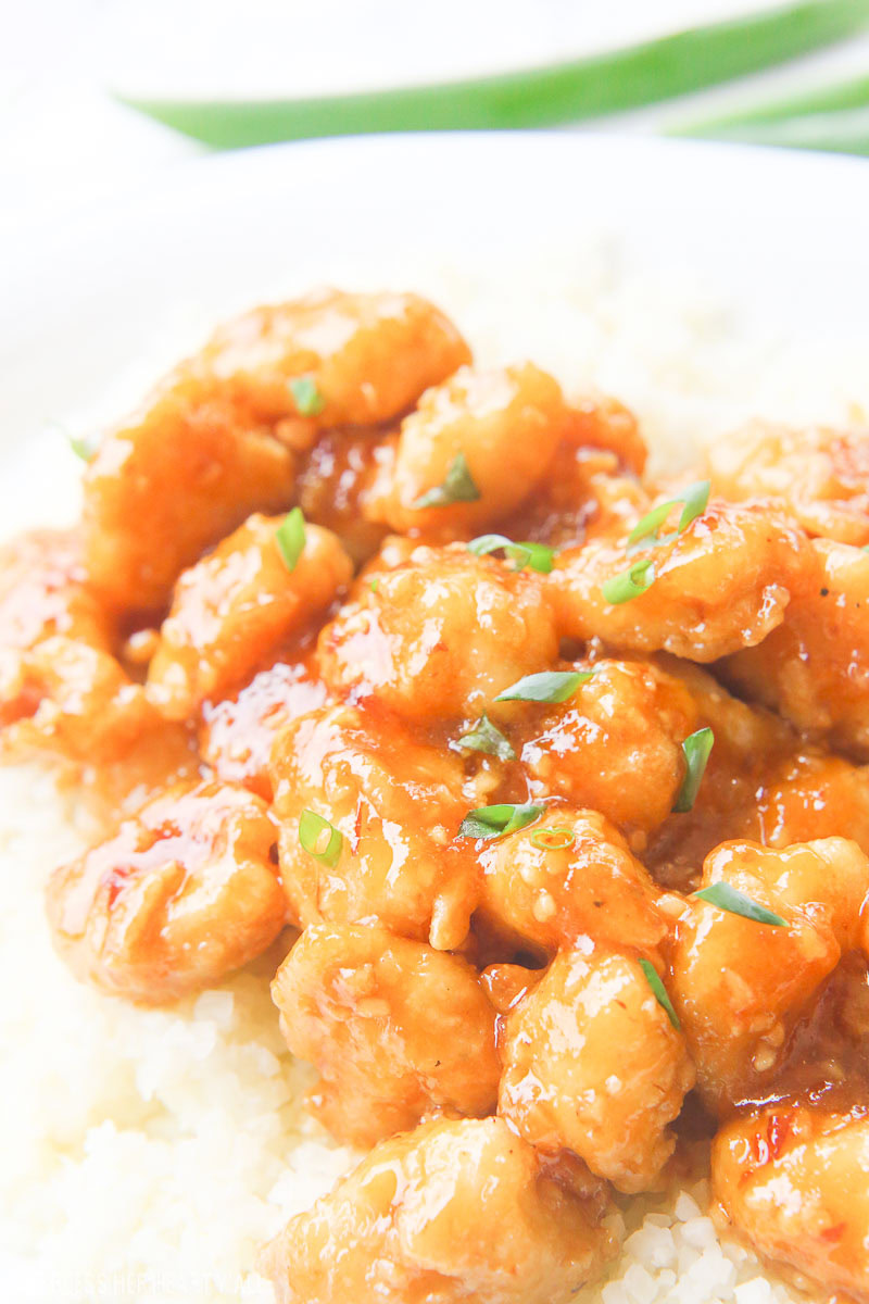 One-pan baked gluten-free sticky honey garlic chicken recipe is 100% gluten free and not fried in a frying pan for even a moment. Tender pieces of chicken are lightly breaded in a homemade spiced coating and then drizzled in coconut oil and a 5-ingredient sticky honey garlic sauce and then baked to perfection. image 3