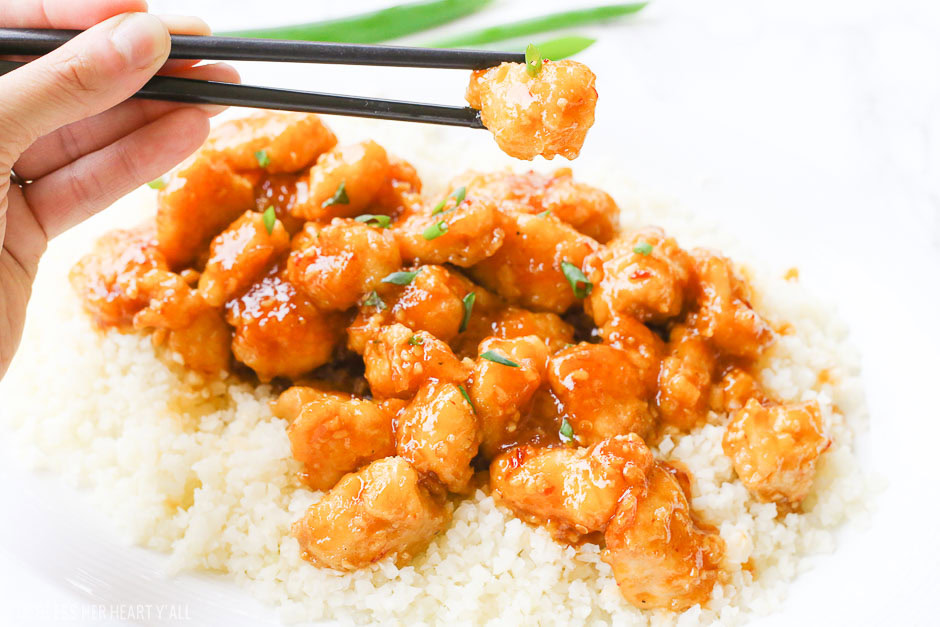 One-pan baked gluten-free sticky honey garlic chicken recipe is 100% gluten free and not fried in a frying pan for even a moment. Tender pieces of chicken are lightly breaded in a homemade spiced coating and then drizzled in coconut oil and a 5-ingredient sticky honey garlic sauce and then baked to perfection. image 6