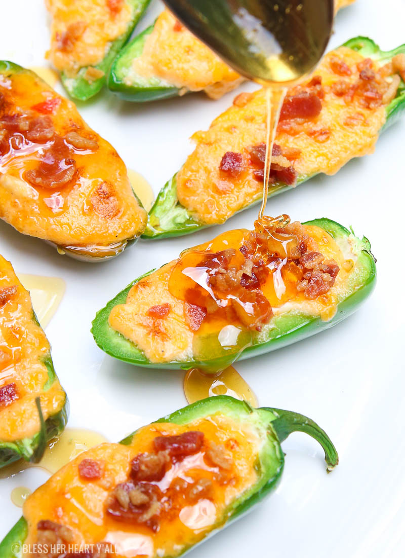 Pimento jalapeno poppers melt fresh jalapenos and pimento cheese together and then top them with crisp bacon crumbles and a drizzle of fresh honey. Each bite combines sweet and spicy with warm melty cheese and crunch. The perfect snack or appetizer in just 5 minutes! 1
