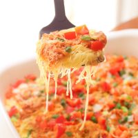 Skinny buffalo chicken spaghetti squash bake combines creamy flavor-packed buffalo chicken with fresh veggies and blue cheese crumbles all on a bed of spaghetti squash!