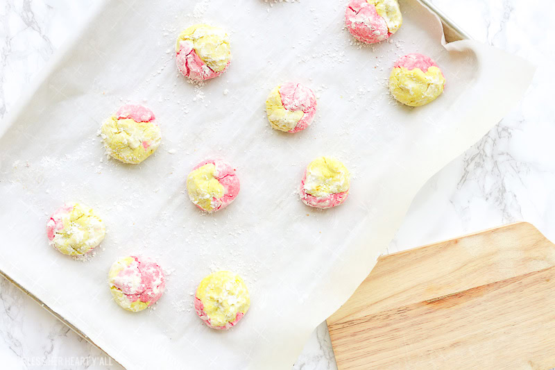 This strawberry lemonade cookie recipe combines zesty lemon flavors with sweet strawberry hints in a soft and fluffy crinkle cookie! These moist gluten free cookies are a great little snack or dessert all summer long! image 1