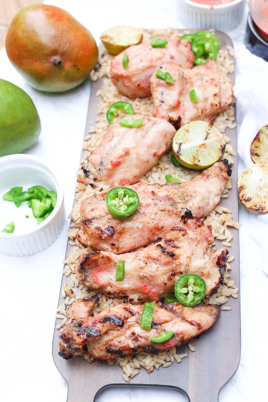 Grilled strawberry mango chicken with fresh jalapenos and grilled lime on a bed of fluffy brown rice!  This healthy delicious meal puts a light tropical flavor in every bite! image 4