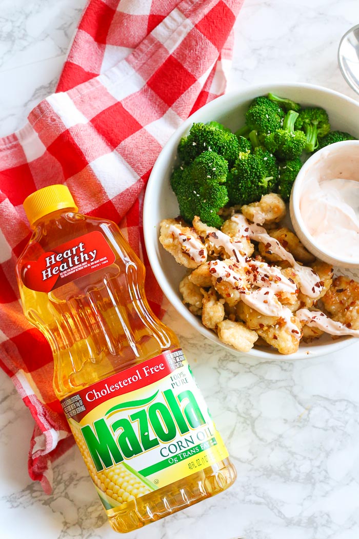 Gluten-Free bang bang chicken in bowl with broccoli and sauce