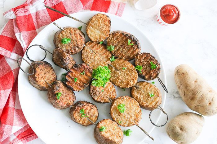 Grilled Marinated Potatoes on Skewers ready to be served