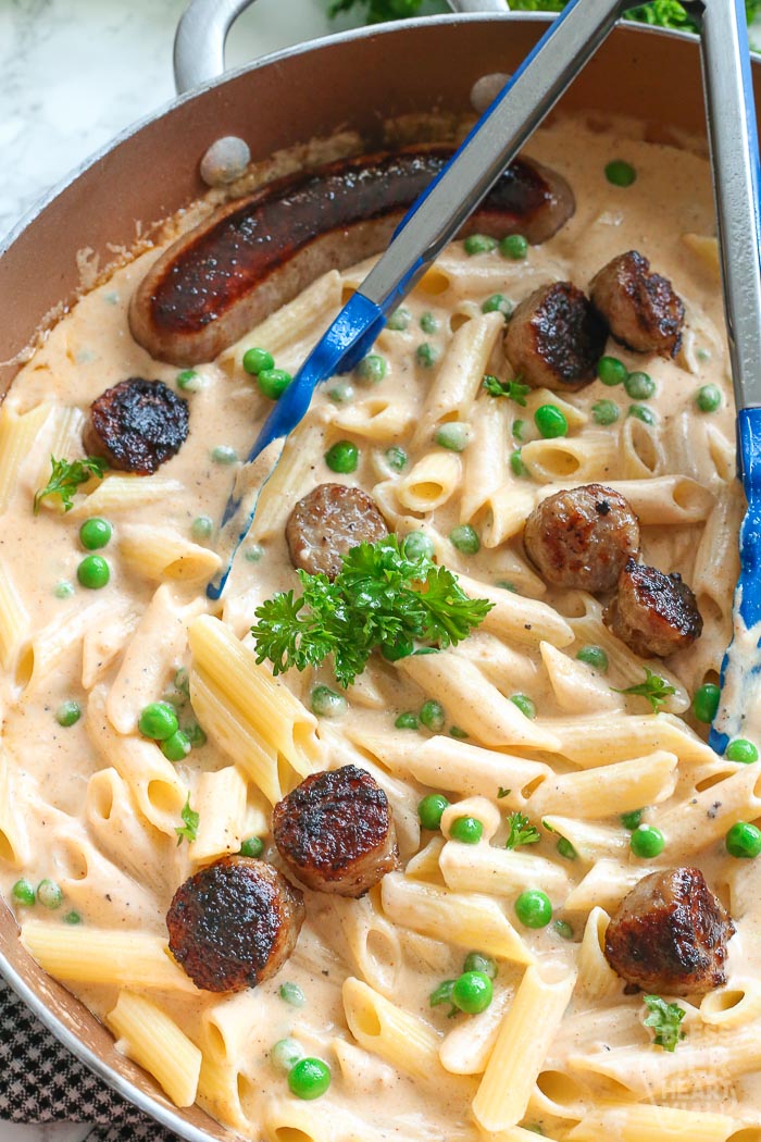 creamy pasta and sauce with bratwurst and parsley