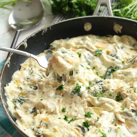 spinach artichoke dip in spoon