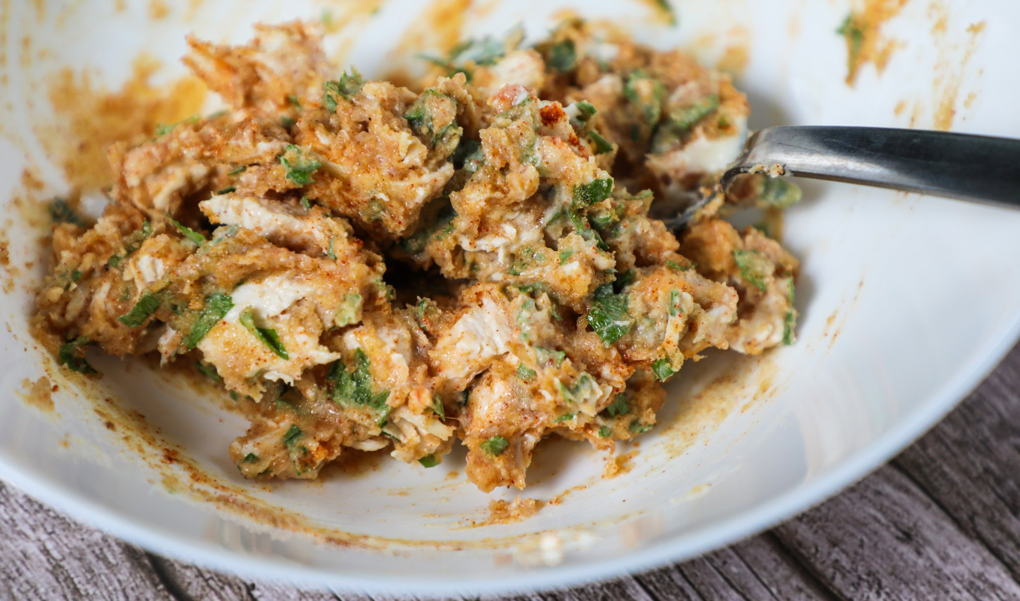 Finished crab mix in a medium white bowl