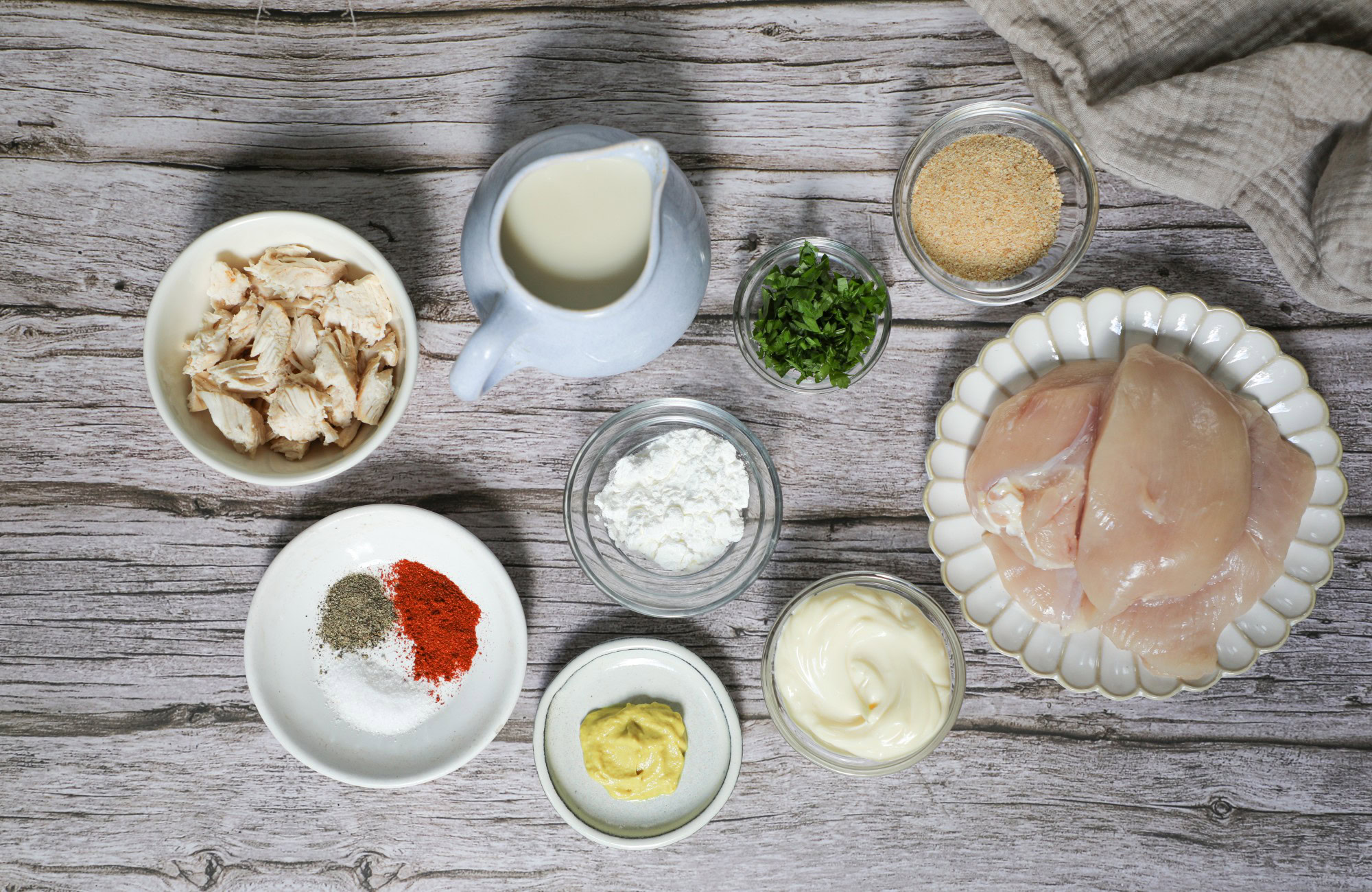 Chicken Chesapeake ingredients displayed on a wooden table