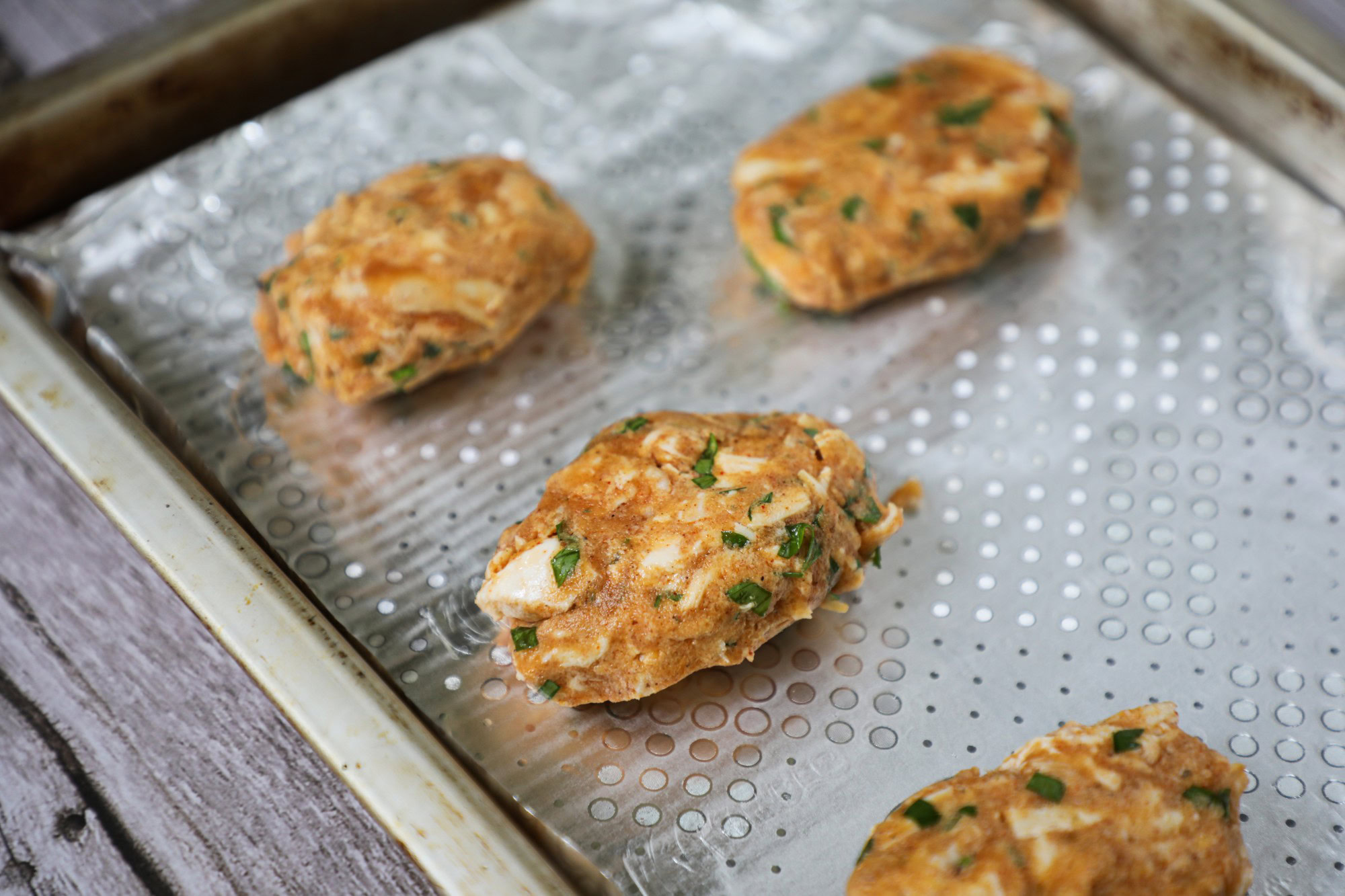 4 crab balls before cooking in the oven