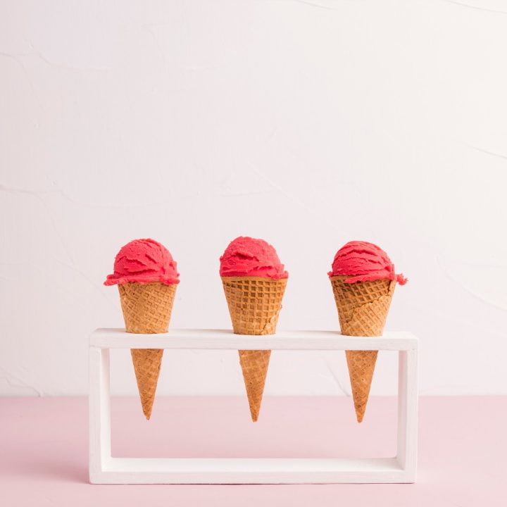 3 cones with big red ice cream scoops on top