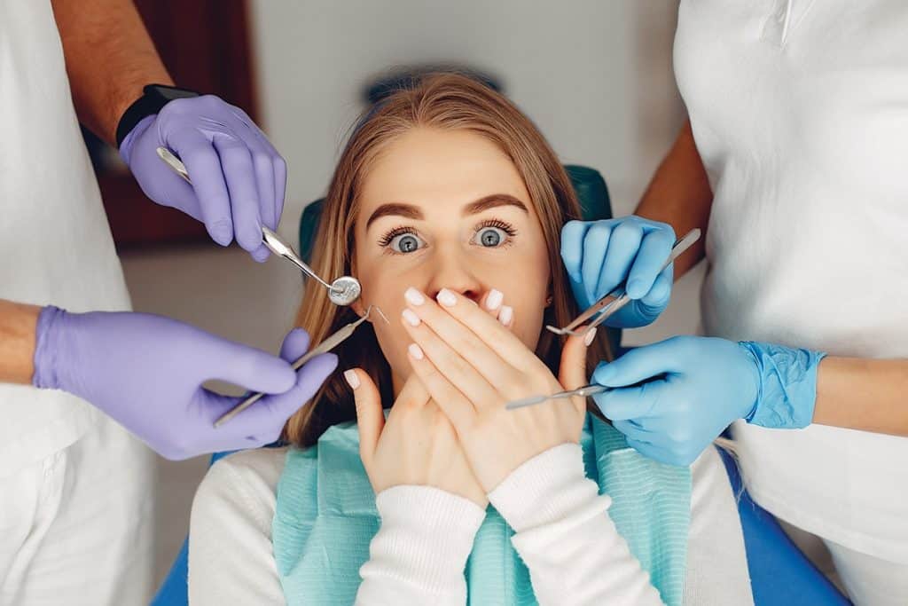 A nervous patient in a dental chair