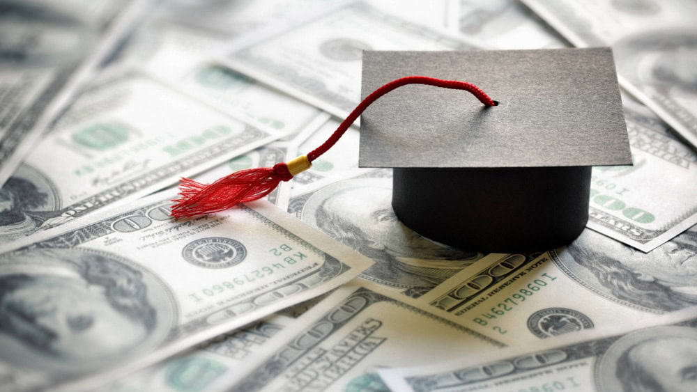 Diploma over stacks of money